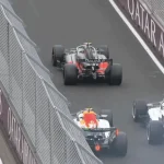 Scare in the pit lane: Lindblad narrowly avoids a collision with Lawson