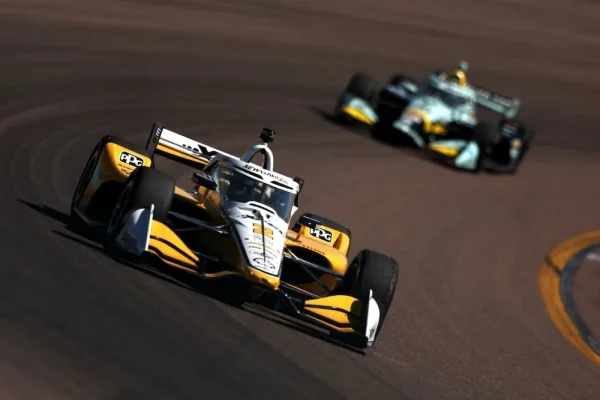 Josef Newgarden (Penske) emerges on the Phoenix oval, Romain Grosjean (Coyne) out of luck