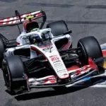 Isack Hadjar grimaces while the Haas drivers exchange insults