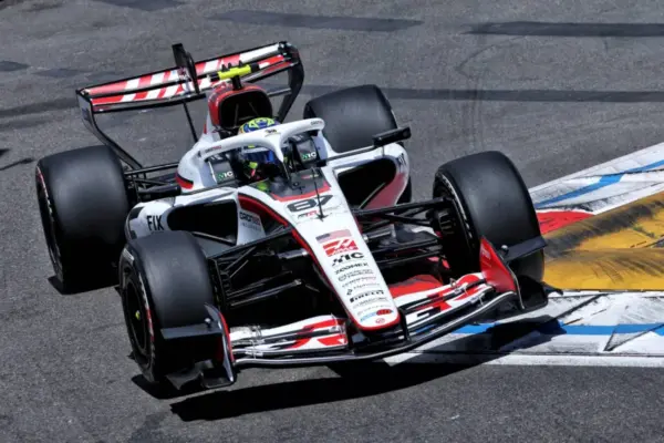 Isack Hadjar grimaces while the Haas drivers exchange insults